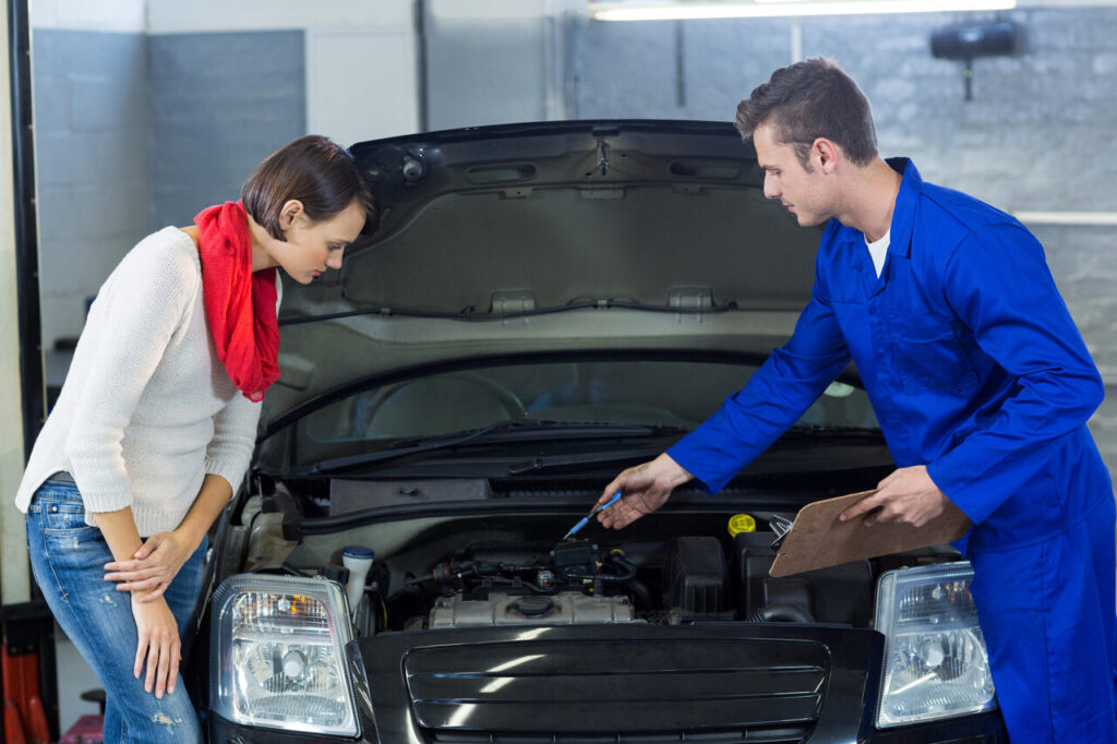 mechanic-showing-customer-problem-with-car (1)