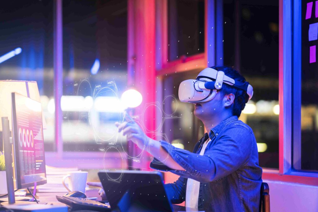 asian-young-male-wearing-wearable-goggle-headset-virtual-online-meeting-digital-space-working-with-3d-augmented-dimension-homecyber-virtual-working-with-virtual-vr-goggle-pc-desktop-device (1) (2)-min_11zon