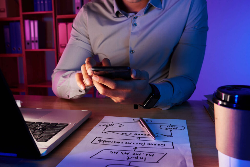 mid-section-unrecognizable-man-taking-picture-work-plan-phone (2)