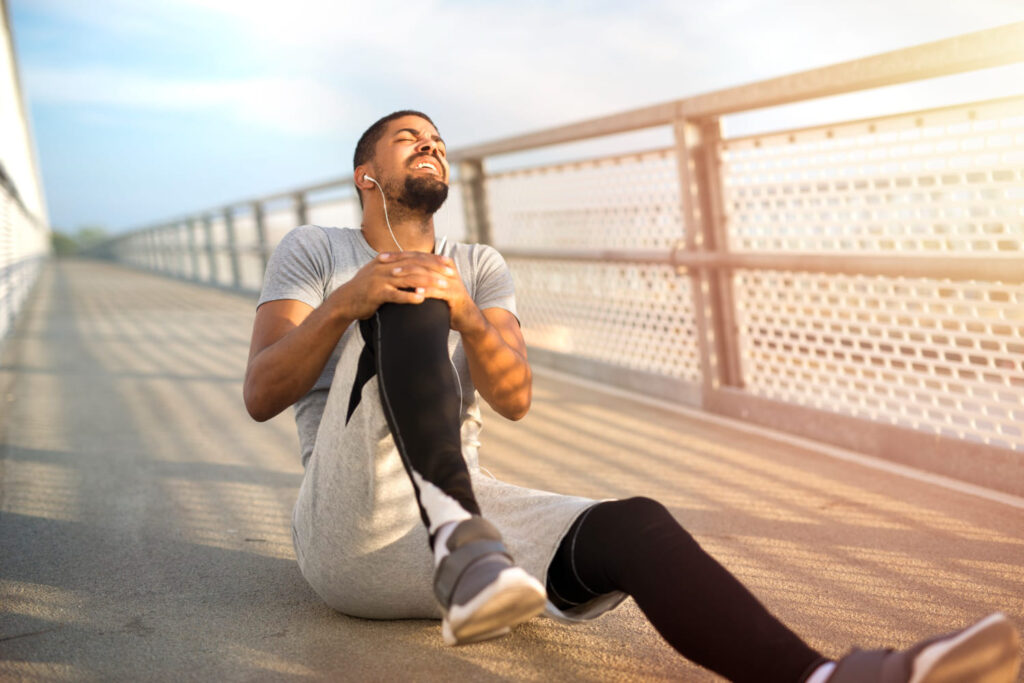 sportsman-having-knee-injury-problem-during-running-training (1)